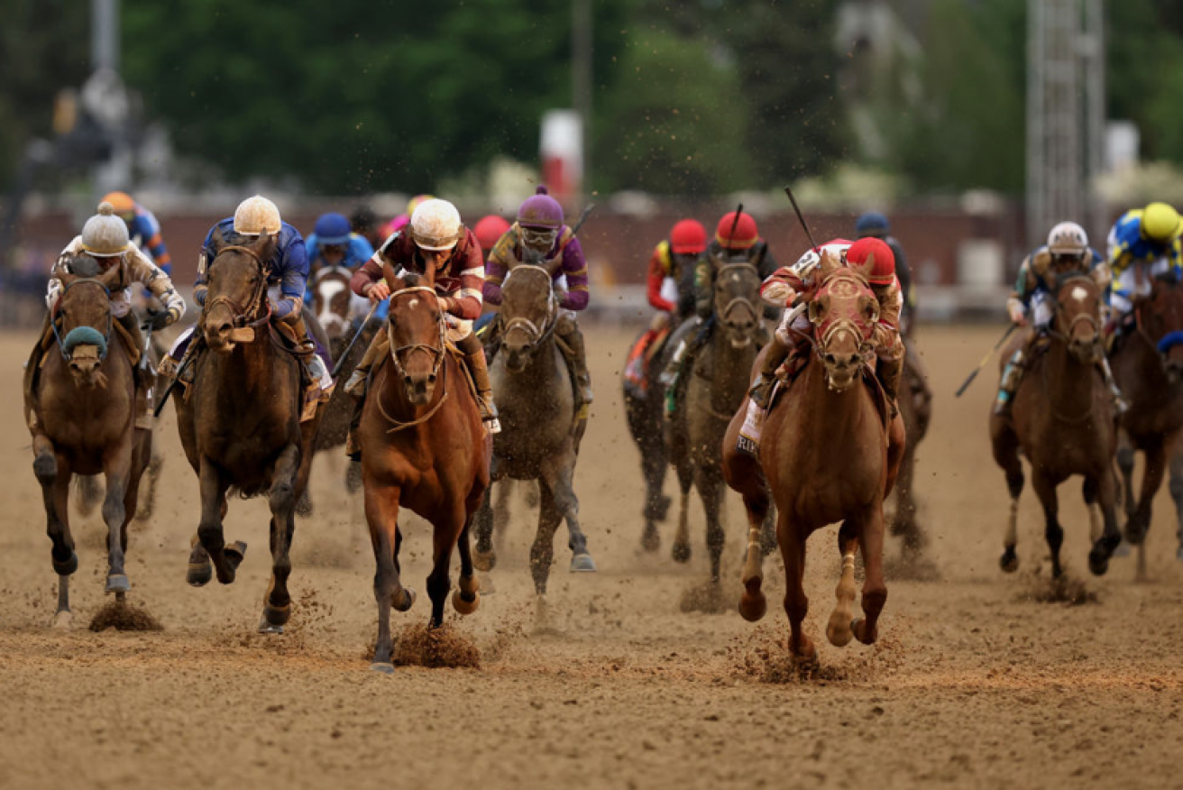 Rank outsider Rich Strike leads the Kentucky Derby field past the winning post at Churchill Downs. <i>Photo: Getty</i>