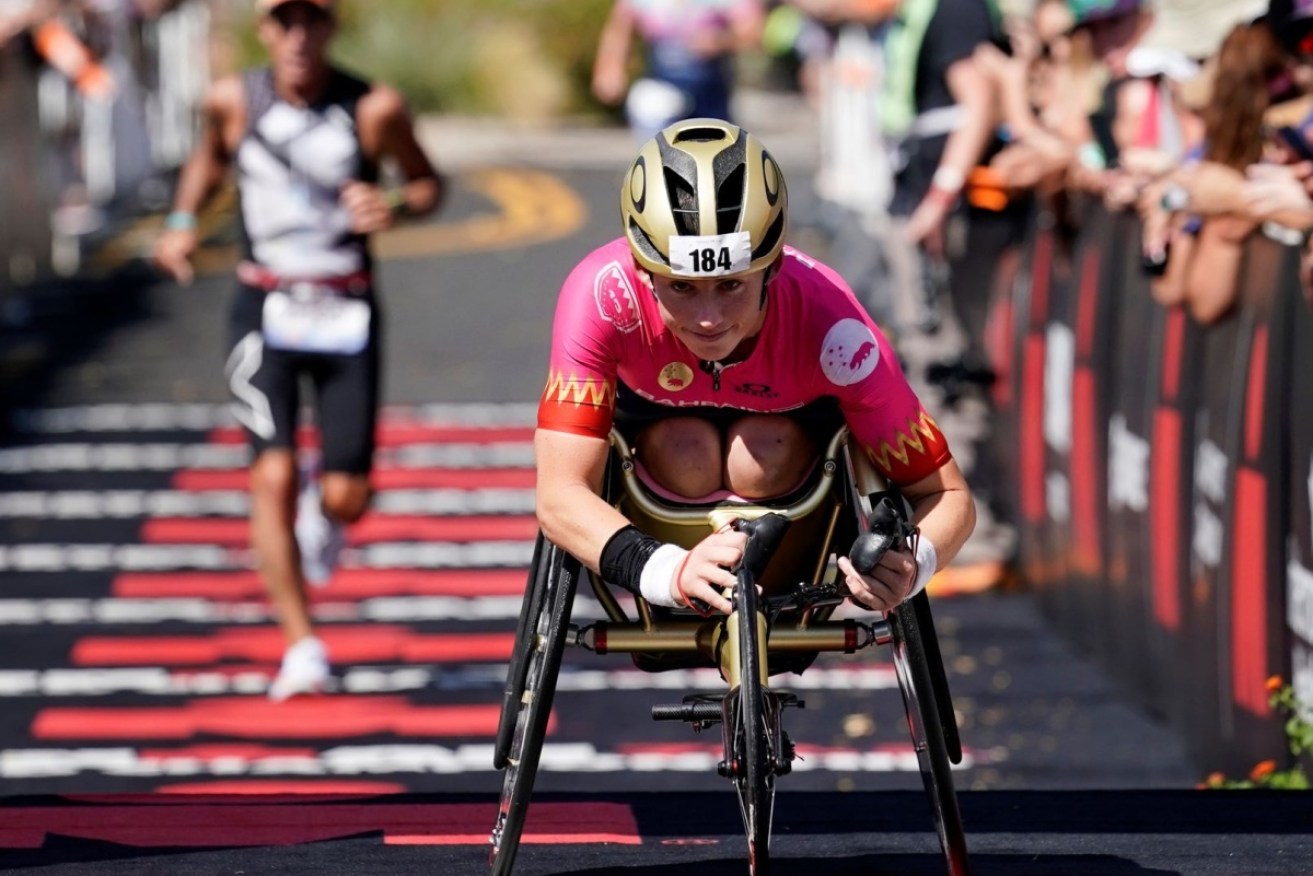 Australian Lauren Parker has finished her first Ironman triathlon as a handcycle entrant.