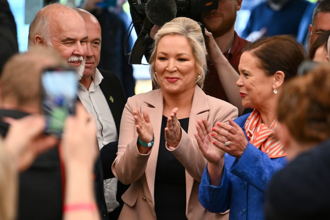 Sinn Féin northern leader, Michelle O'Neill (centre) and leader Mary Lou McDonald celebrate the historic victory.