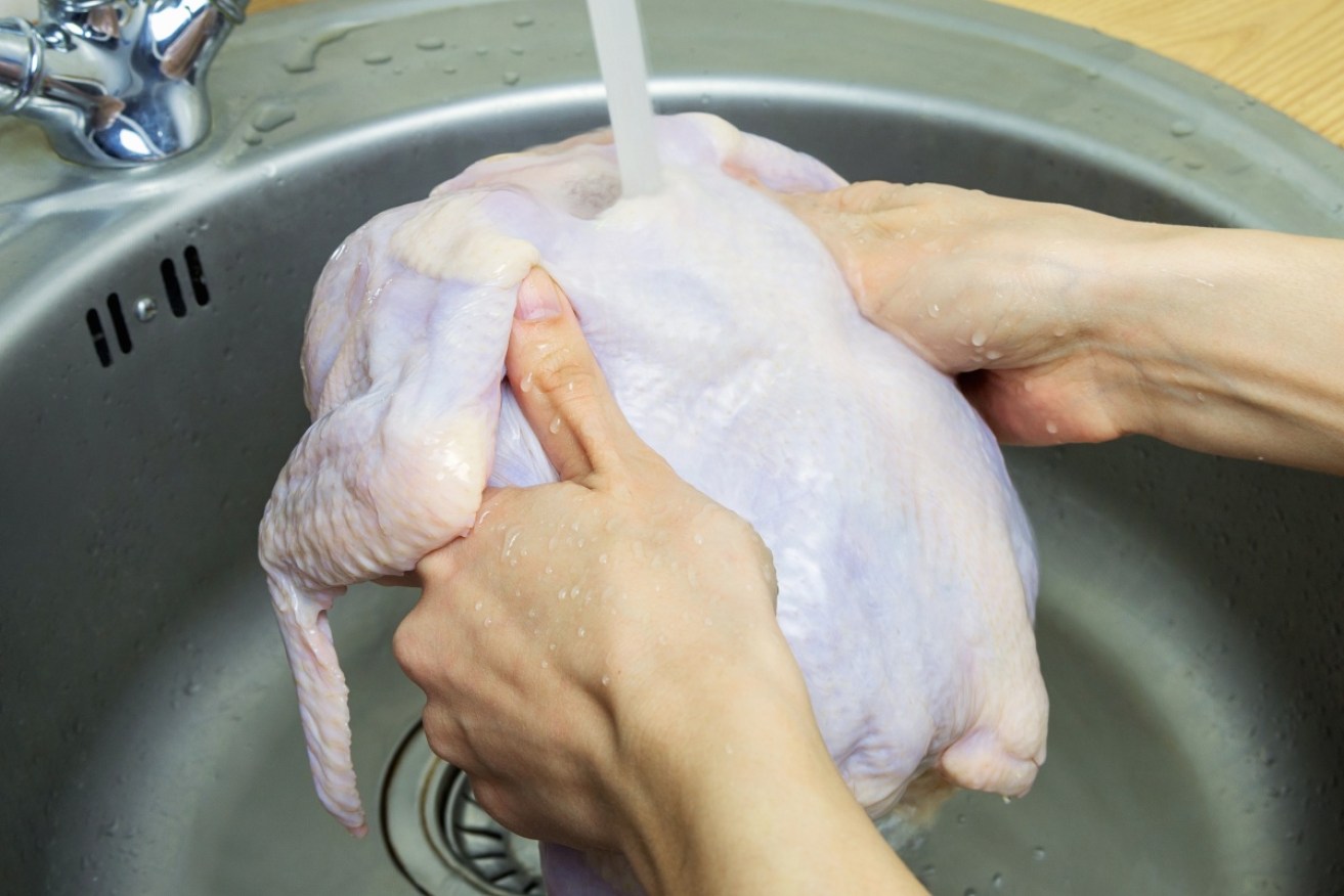 If you really must wash your raw chicken, don't do it under a running tap.  