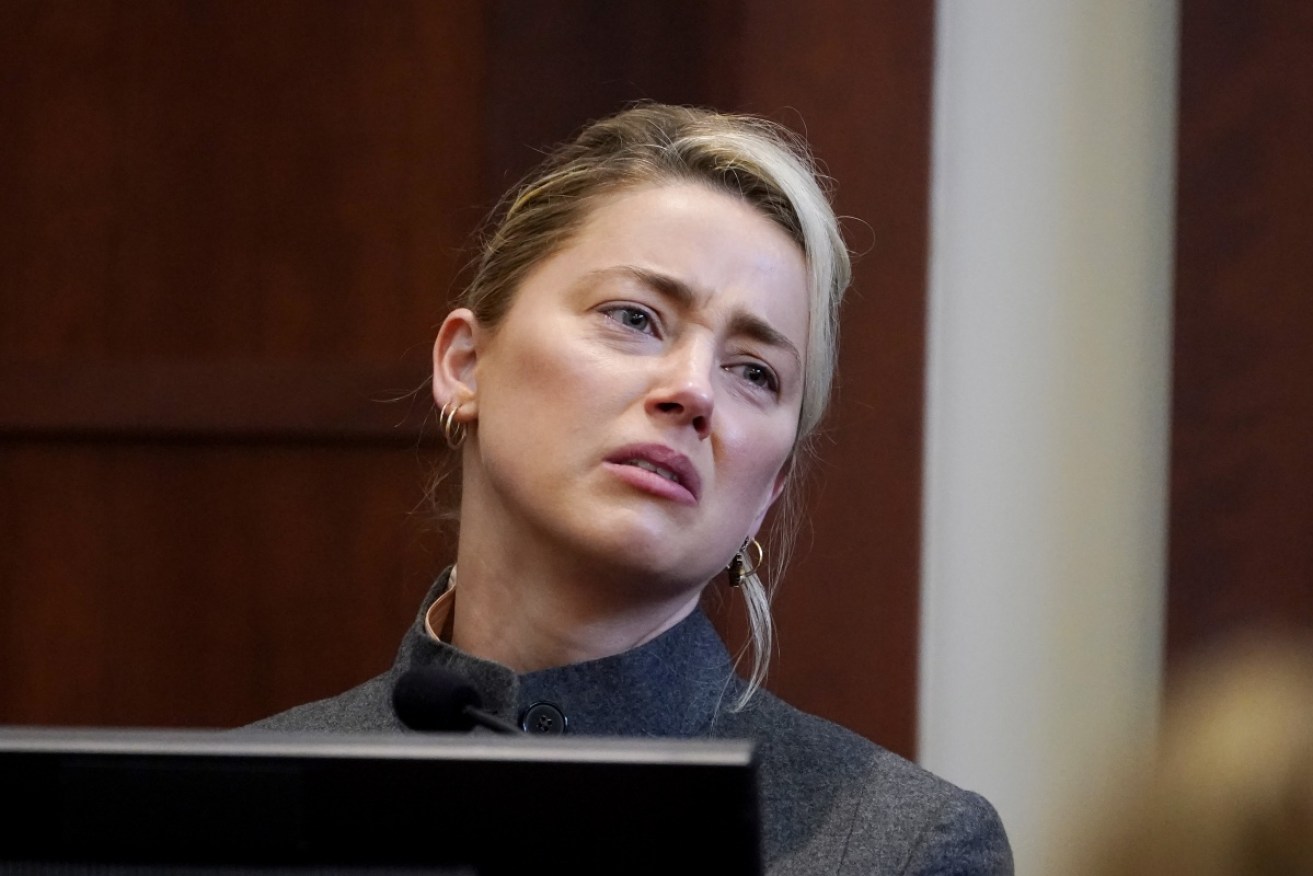 Amber Heard says filing for divorce "was hard because I loved Johnny so much".