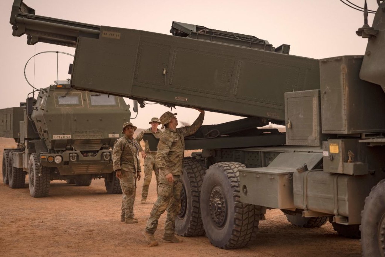 A US soldier checks the readiness of a HIMARS launcher similar to the version that will soon join Australia's national arsenal.