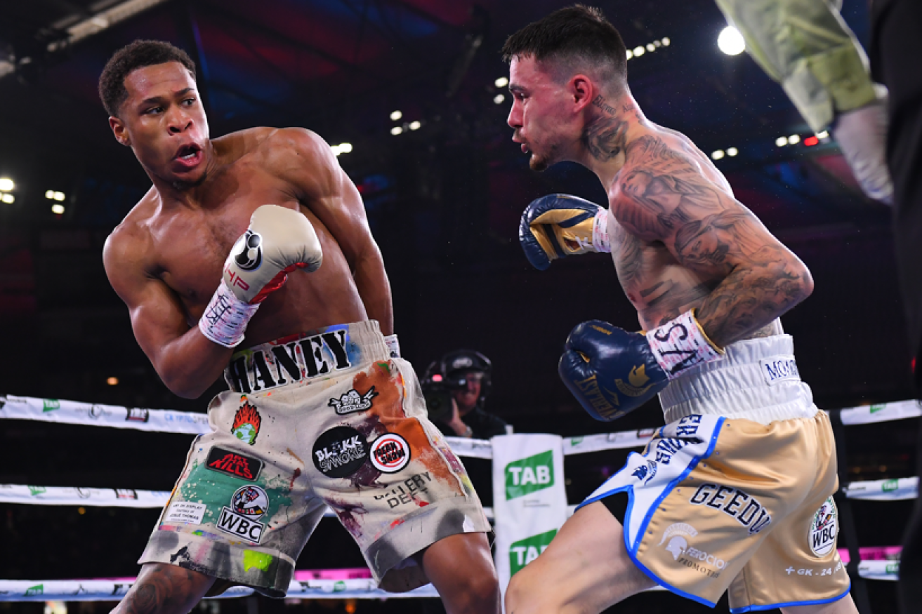 New and undisputed lord of the ring Devin Haney sidesteps a Kombosos jab early in the bout. <i>Photo: AAP</i>