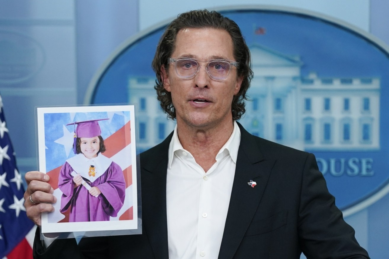 An emotional Matthew McConaughey holds a picture of Texas mass-shooting victim Alithia Ramirez, 10.