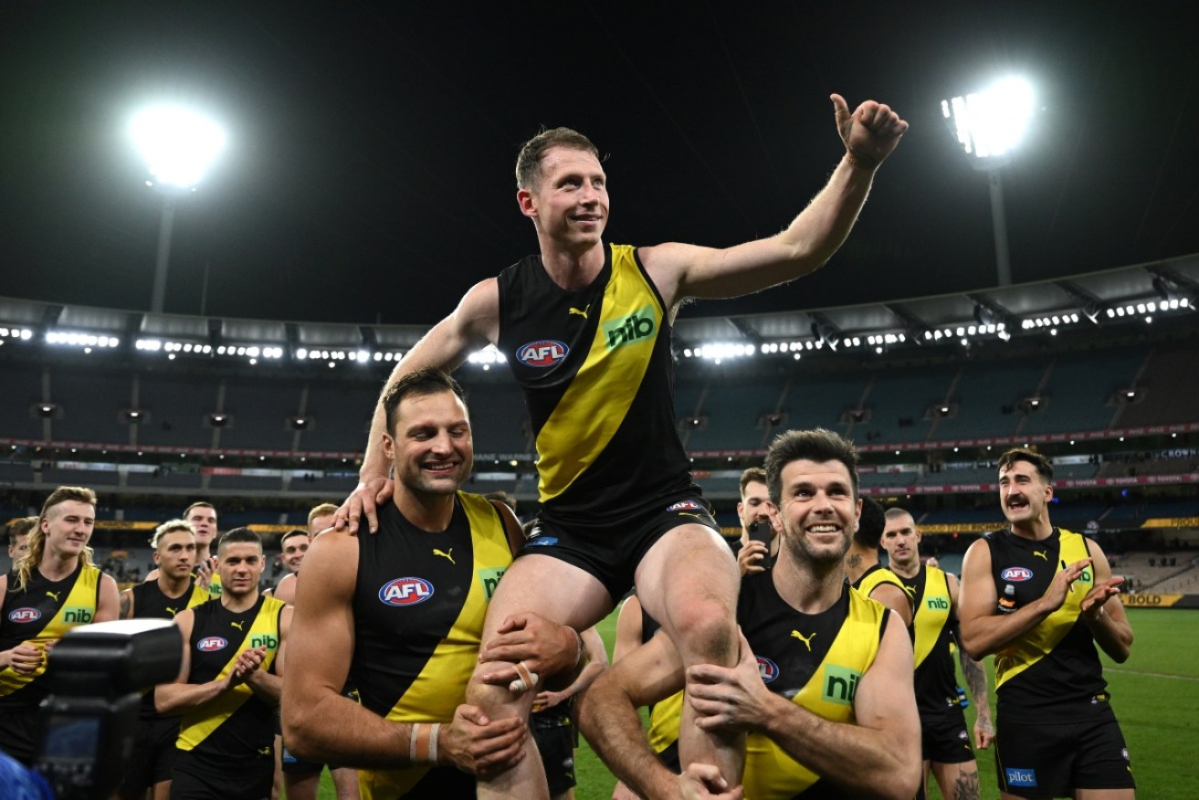 Richmond ensured Dylan Grimes [centre] celebrated his 200th AFL game with a win over Port Adelaide.