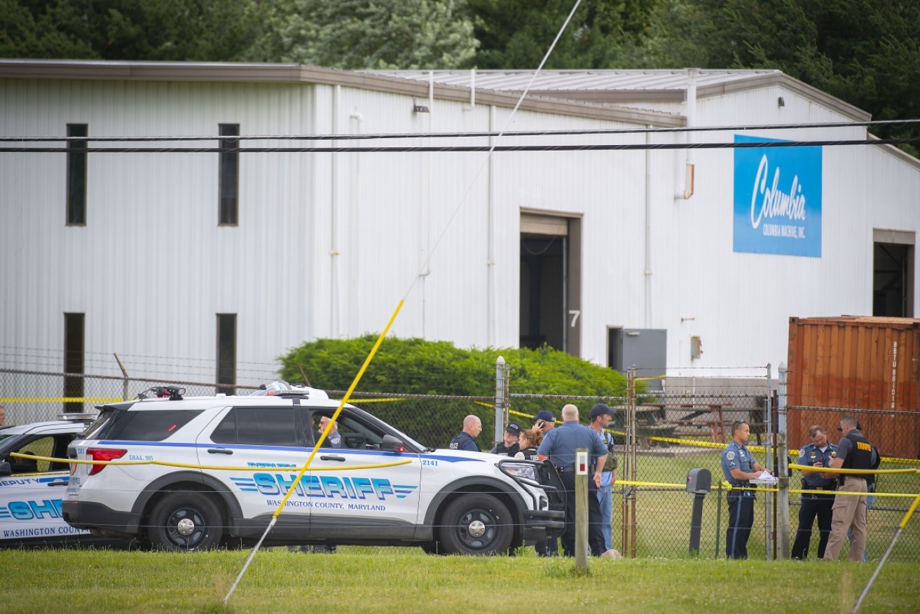 Police officers at the scene of a fatal shooting in the US state of Maryland.