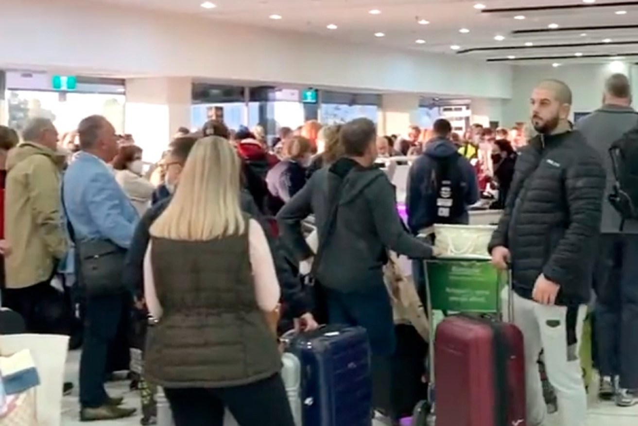 The crowd inside the Virgin Australia terminal in Melbourne on Friday.