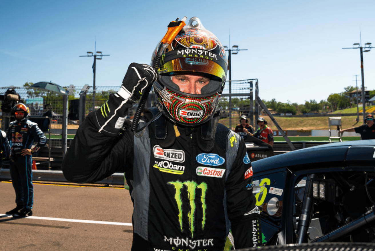 Ford driver Cam Waters raises a fist in triumph after taking the checkered flag in Darwin. <i>Photo: Getty</i>