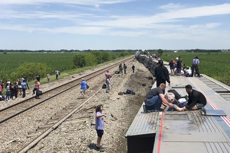 Three dead when US train hits truck, derails