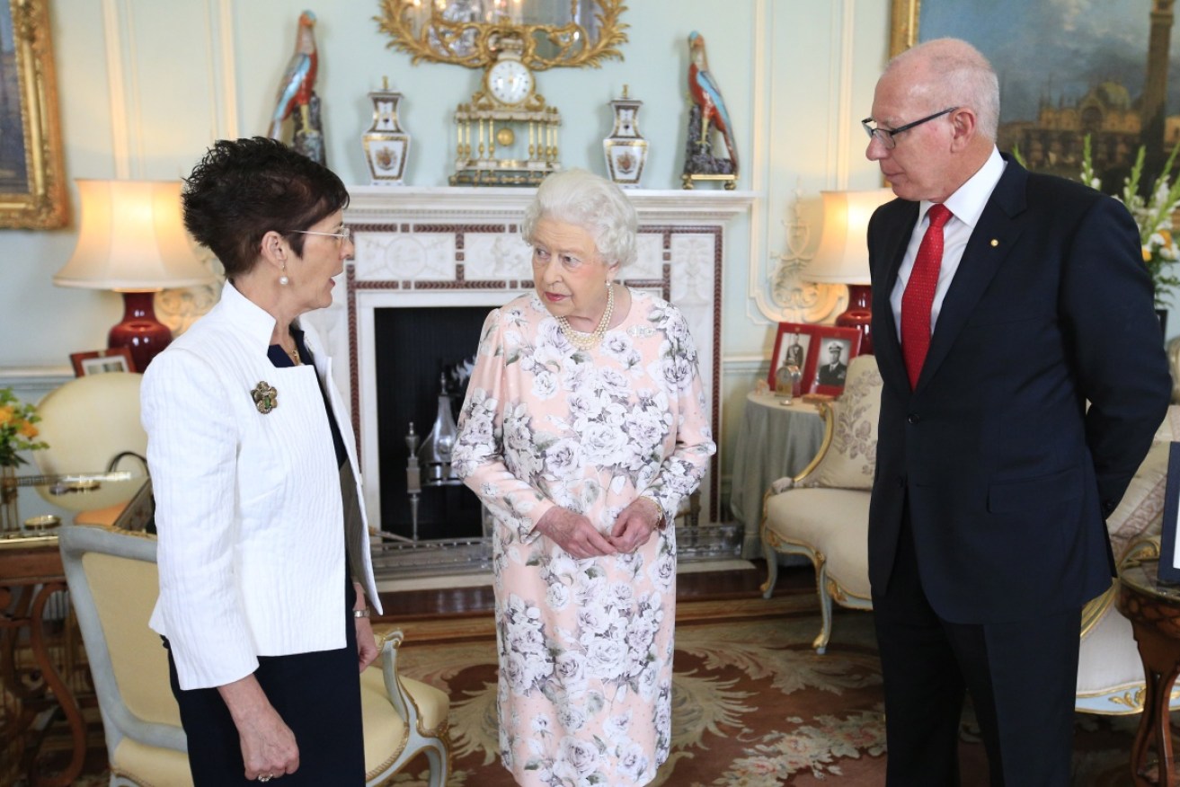 David and Linda Hurley with the Queen at Buckingham Palace.