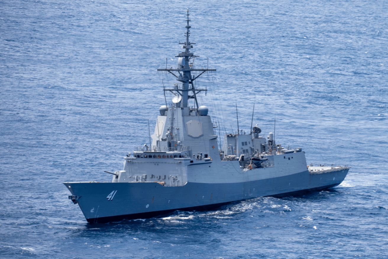 HMAS Brisbane plucked the stranded yachties from the sea after being alerted by a passing cargo vessel. <i>Photo: RAN</i>