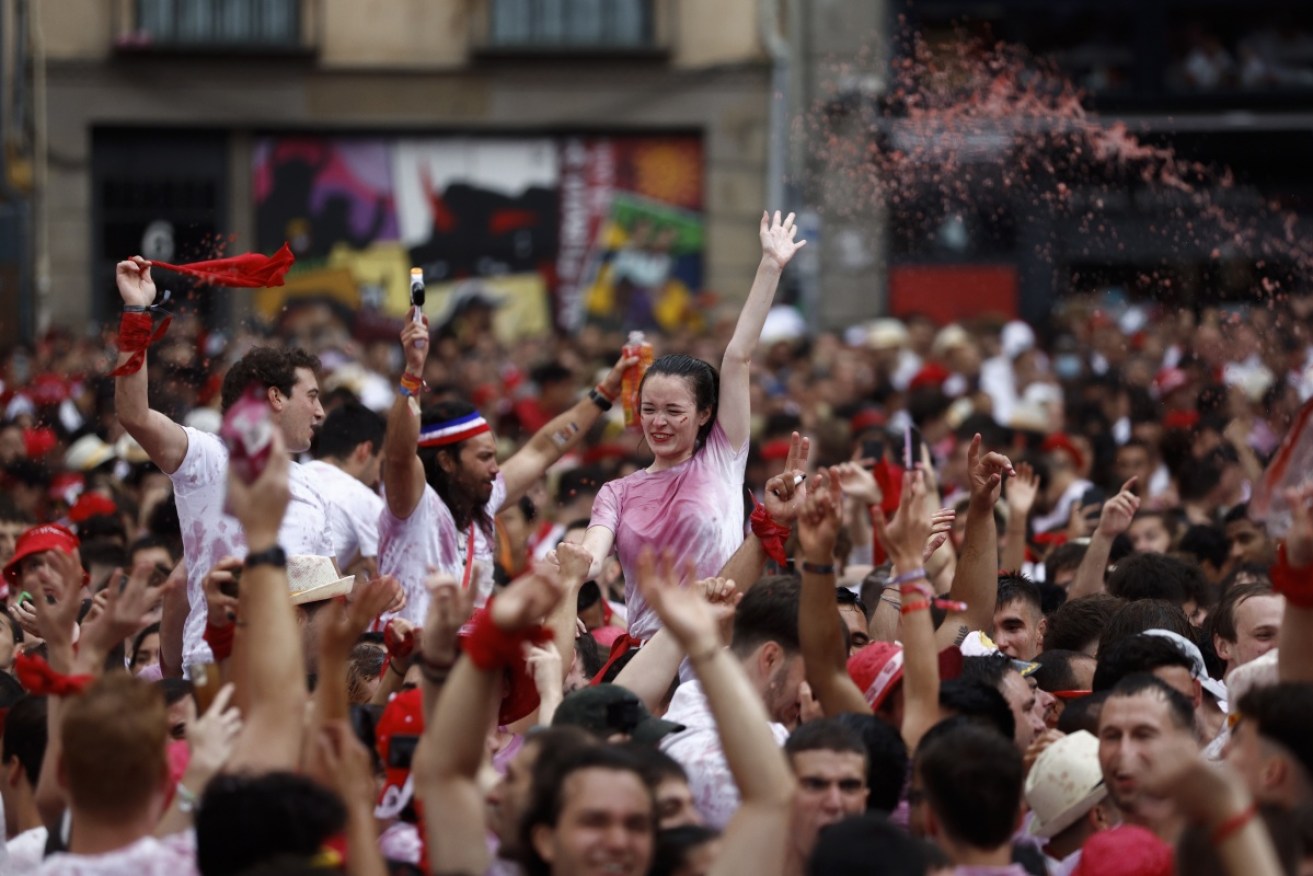 Thousands of revellers have erupted in celebration at the start of the San Fermín bull-run festival.