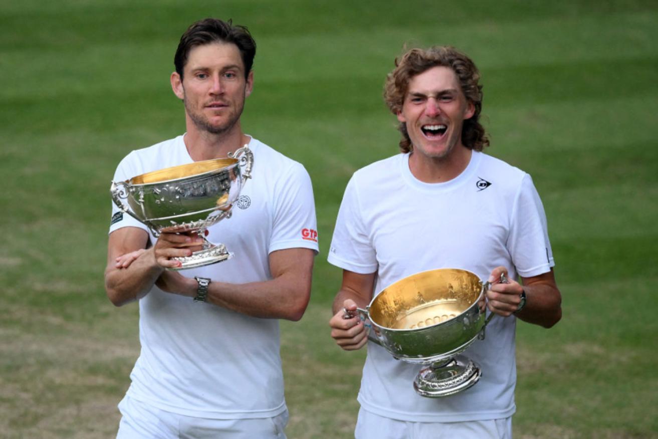 Matthew Ebden (left) and Max Purcell revel in their hard-won triumph after claiming the men's doubles crown. <i>Photo: Getty</i>