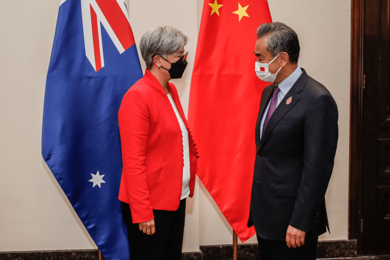 Foreign Minister Penny Wong and Chinese counterpart Wang Yi exchange views at the G20 summit in Bali. <i>Photo: AAP</i>