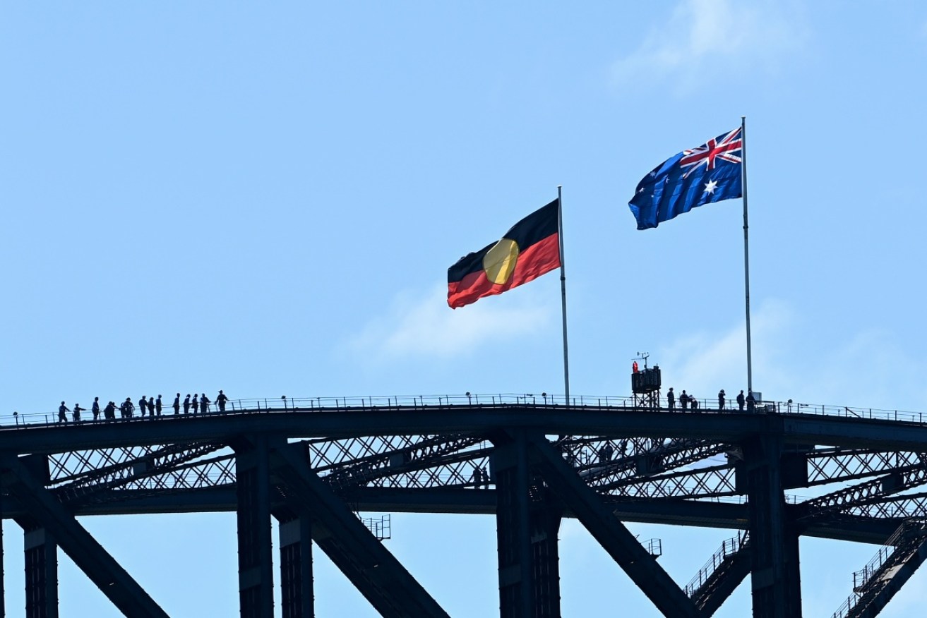 The Aboriginal flag will permanently replace the NSW flag on top of the Sydney Harbour Bridge. 