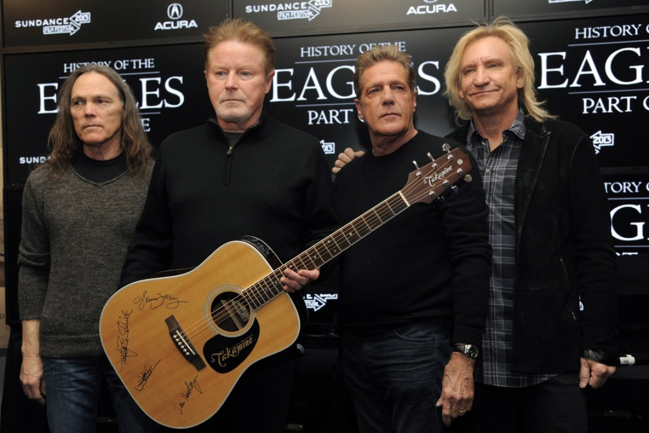 Three men have been charged with possessing 100 pages of notes and lyrics stolen from The Eagles.