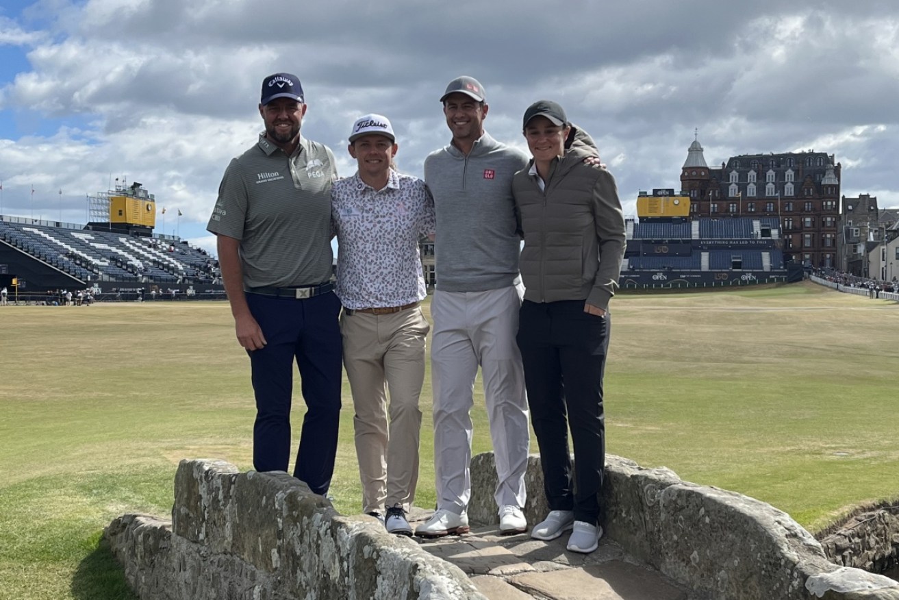 Australian golfers Marc Leishman, Cam Smith and Adam Scott pose with Ash Barty at St Andrews. 