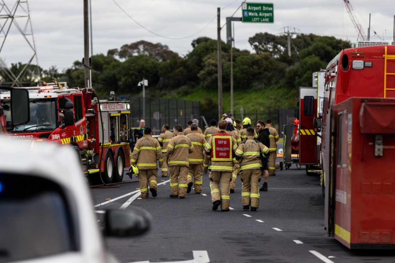 Fire crews are clearing a 40-tonne chemical spill on Melbourne's Western Ring Road after a large b-double truck rolled over.