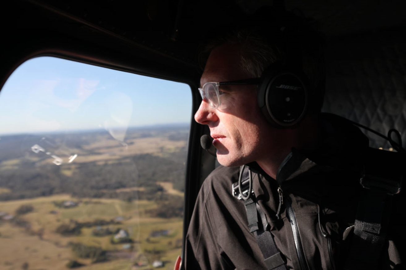 NSW Premier Dominic Perrottet surveys flood damage from the air during the last massive inundation. <i>Photo: Getty</i>