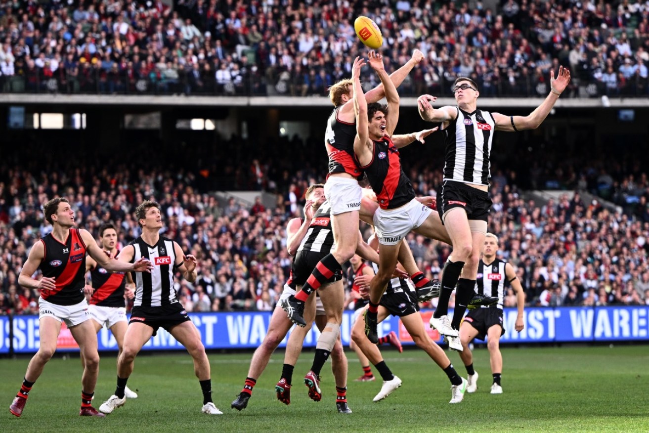 Collingwood has overcome Essendon in an MCG thriller with an after-the-siren goal by Jamie Elliott.