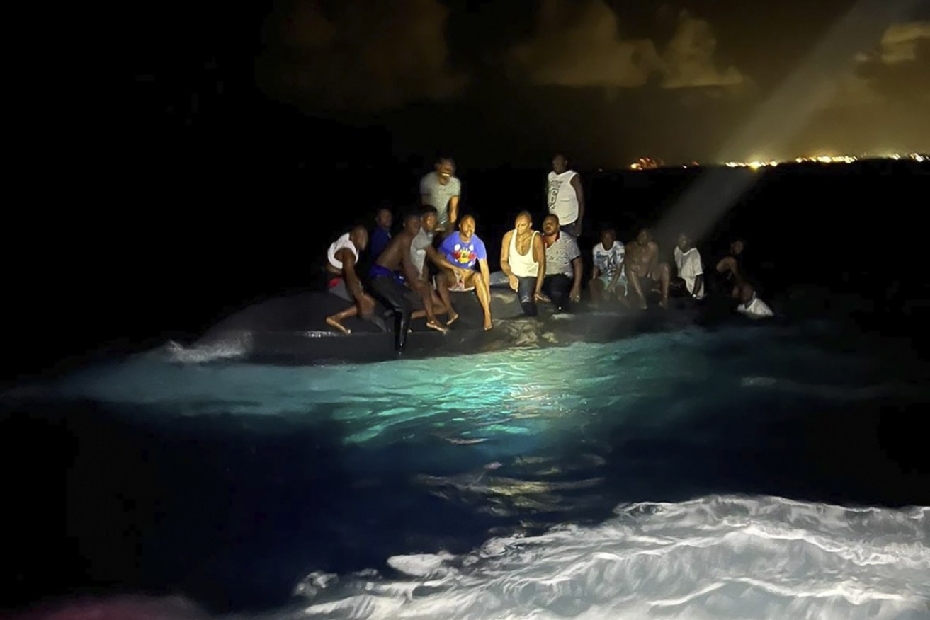 A boat carrying up to 60 Haitian migrants has capsized off the Bahamas, killing at least 17 people. 