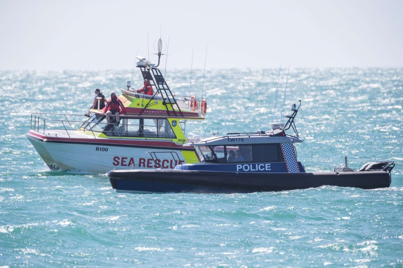 A man has been rescued after spending the night in the water off Western Australia.