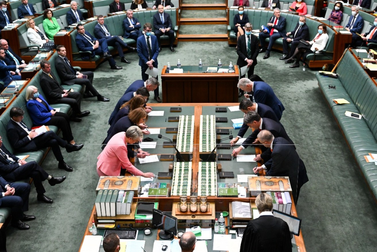 When not speaking, Labor MPs wore masks. But most Coalition MPs did not.