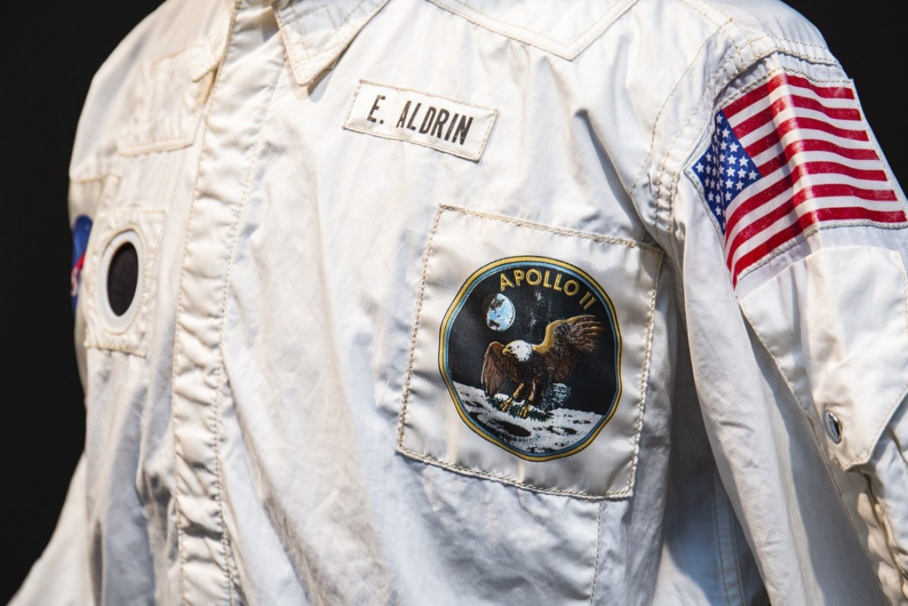 Edwin 'Buzz' Aldrin's 1969 moon-walk jacket has fetched $4m at auction in the United States. 