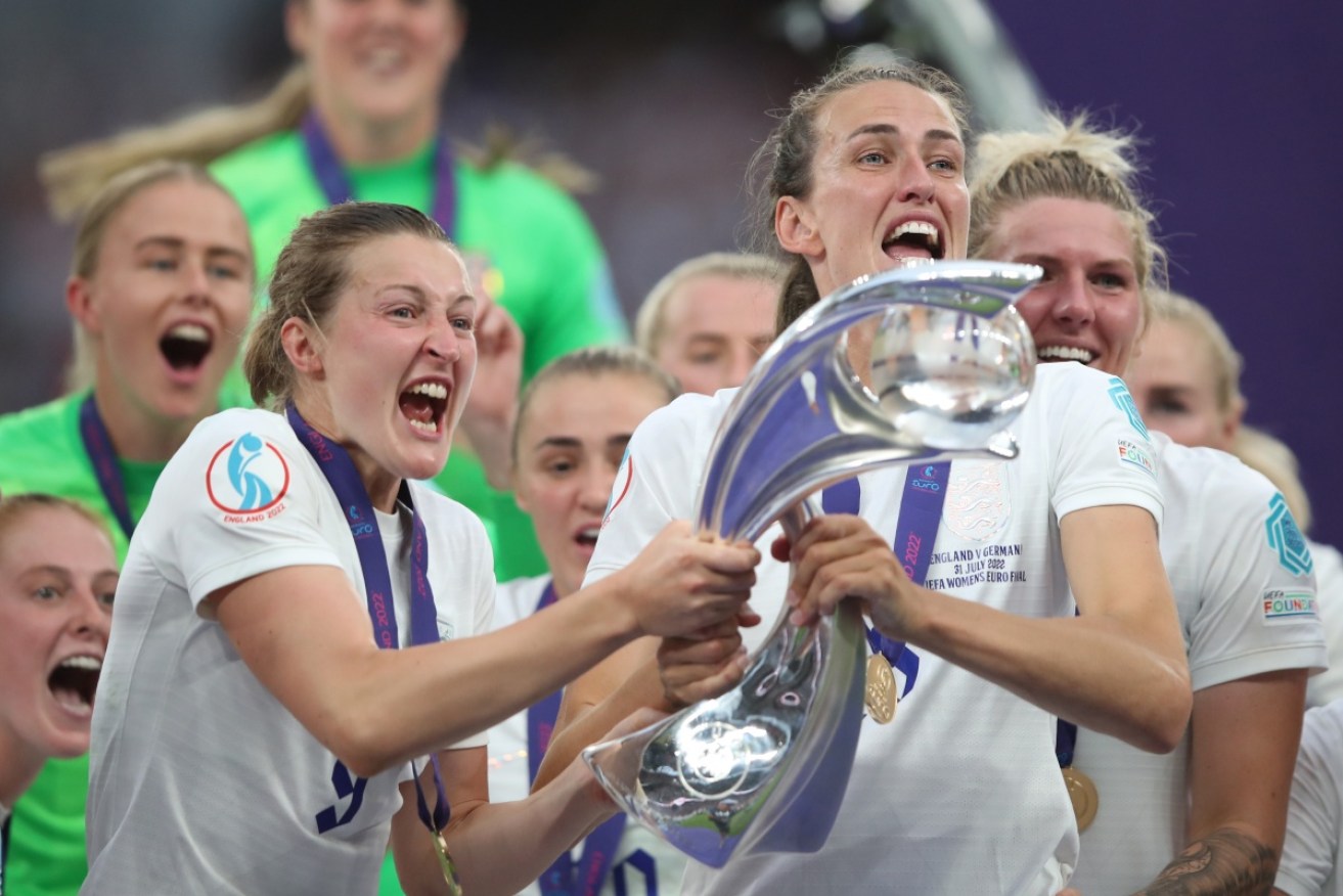 England's Jill Scott and Ellen White celebrate the team's historic victory.