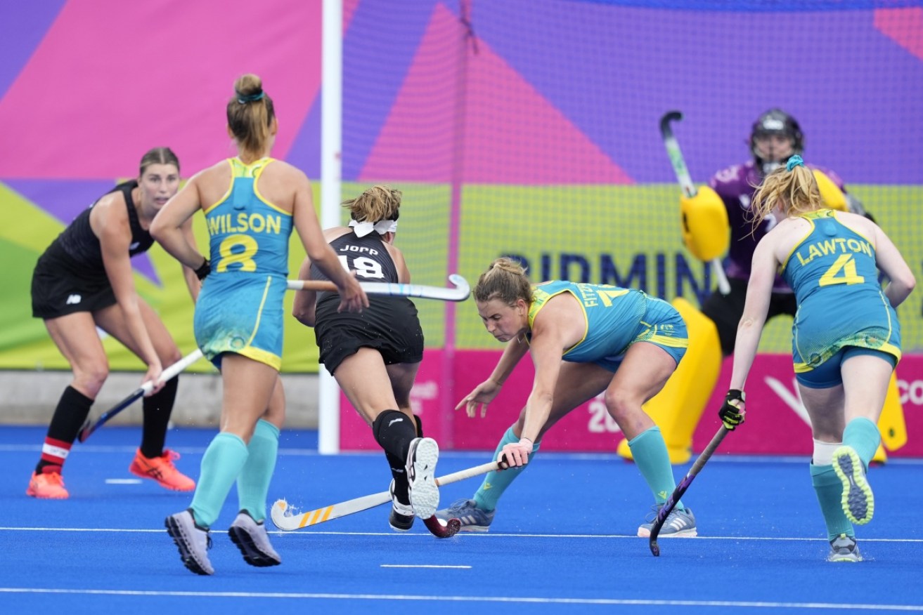 Maddy Fitzpatrick, thwarts an attack by New Zealand's Tessa Jop on Tuesday. 