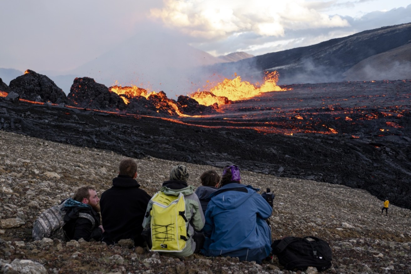 The eruption has drawn plenty of onlookers  – although they have been urged to stay away due to volcanic gases.