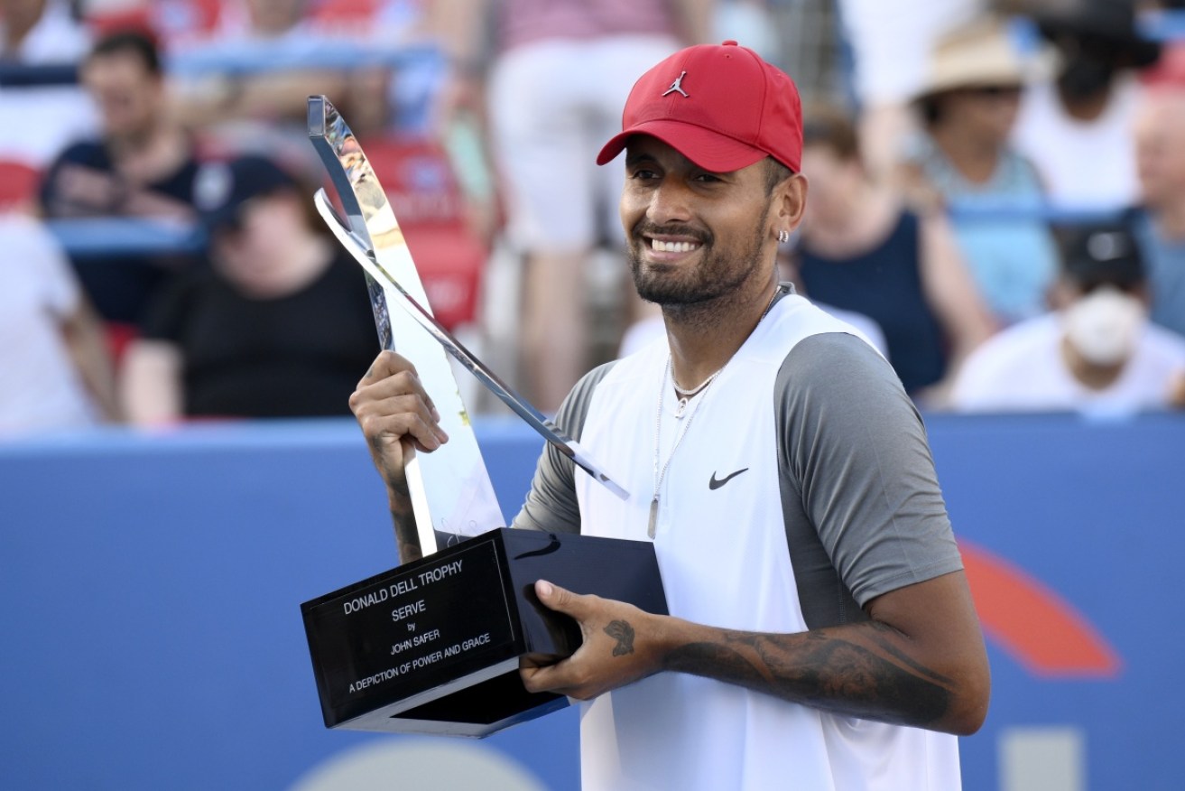 Nick Kyrgios celebrates winning his seventh ATP title with victory in the Washington Open final.