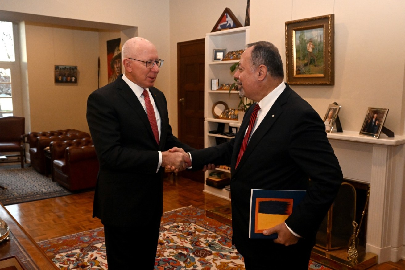 Governor-General David Hurley, left, receives the interim report from commissioner Nick Kaldas.