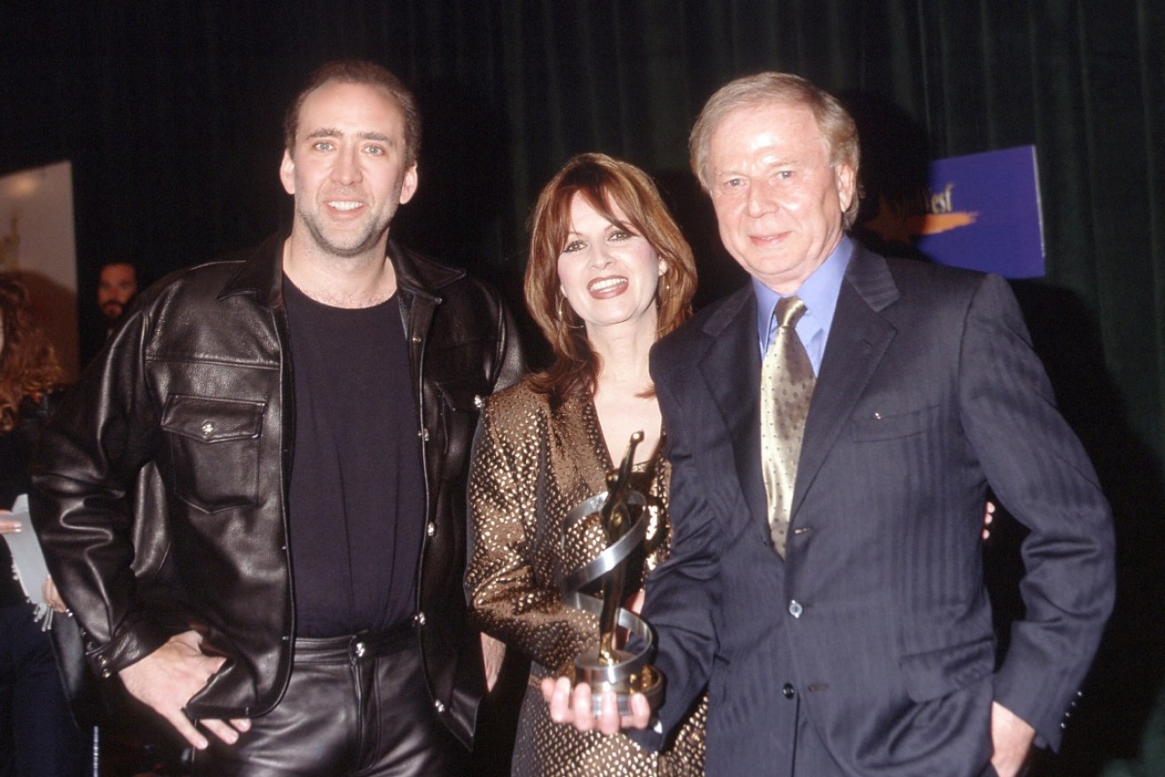Wolfgang Petersen with his wife Maria and actor Nicholas Cage in 2001.