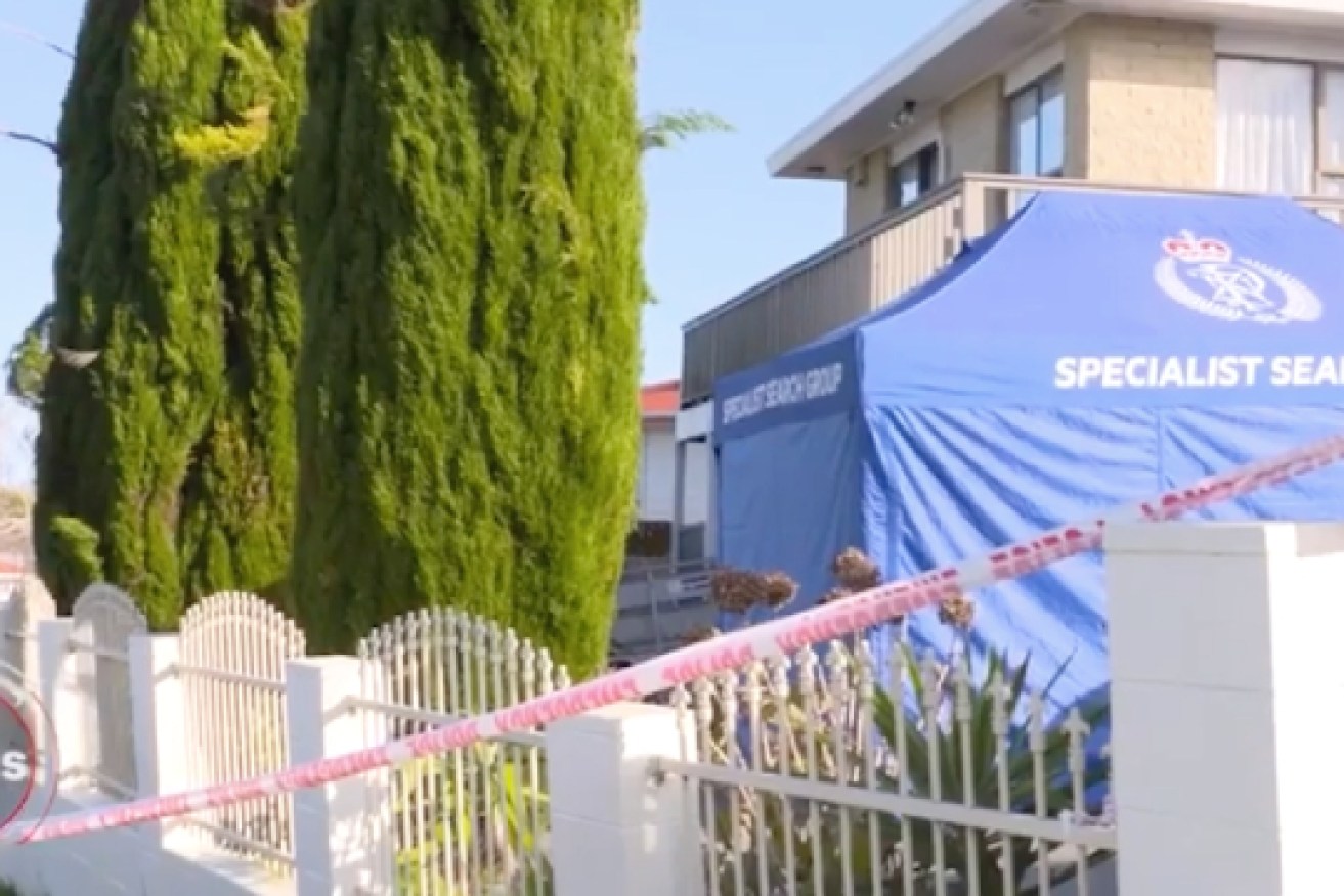 New Zealand Police at the Auckland site where the bodies of two children were found in suitcases.