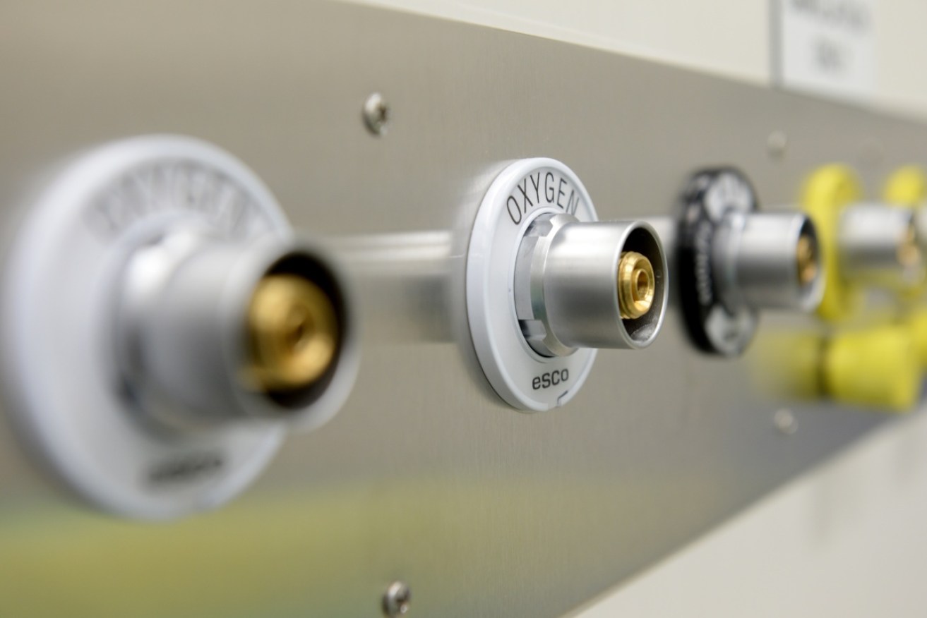 A gasfitter has been charged with a newborn's manslaughter and causing serious harm to another baby.