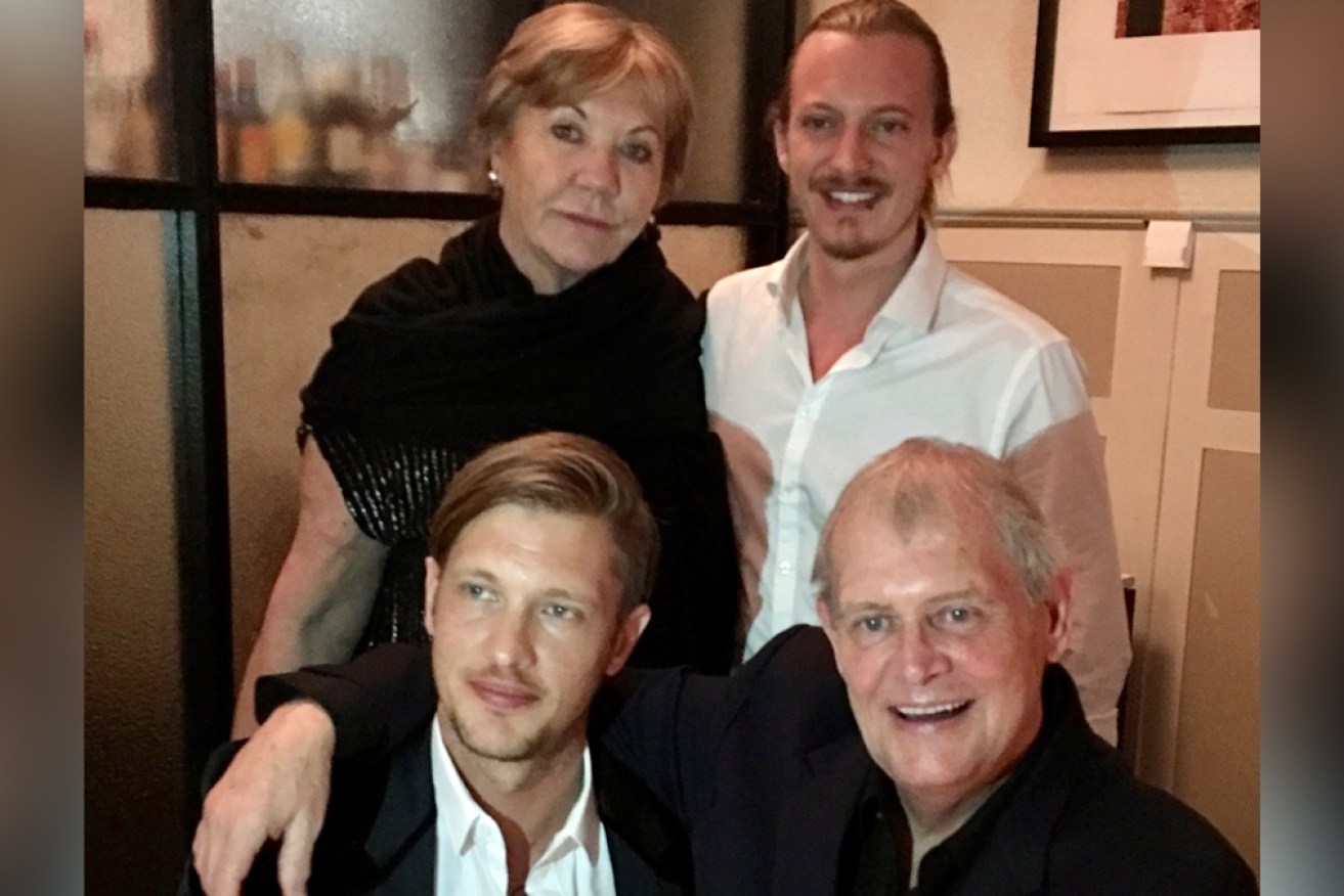John Farnham with wife Jill and sons Rob and James. He is in back in hospital, with a respiratory infection.