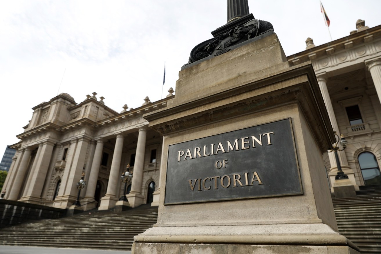 A man is to be charged over giving a Nazi salute under laws just passed by the Victorian Parliament.
