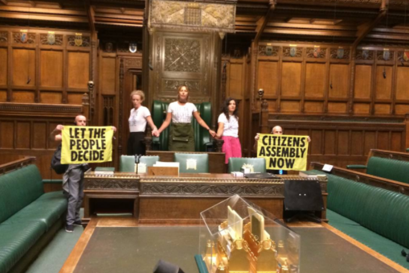 Protesters ring the Speaker's chair in the House of Commons at the start of what Extinction Rebellion says will be a month of rolling demonstrations. <i>Photo: Twitter</i>