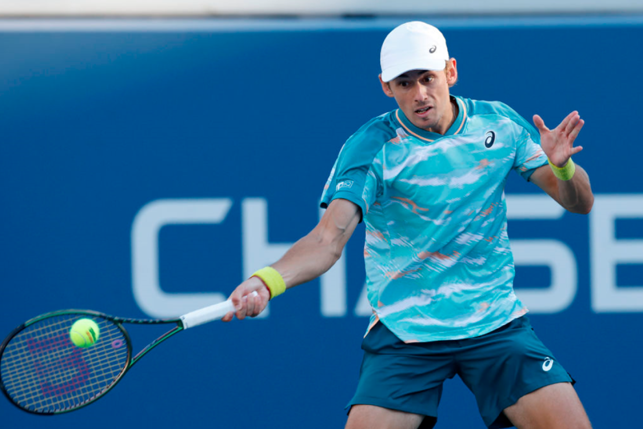 Alex de Minaur returns a shot during his doomed fightback against Spain's Pablo Carreno Busta. <i>Photo: Getty</i>