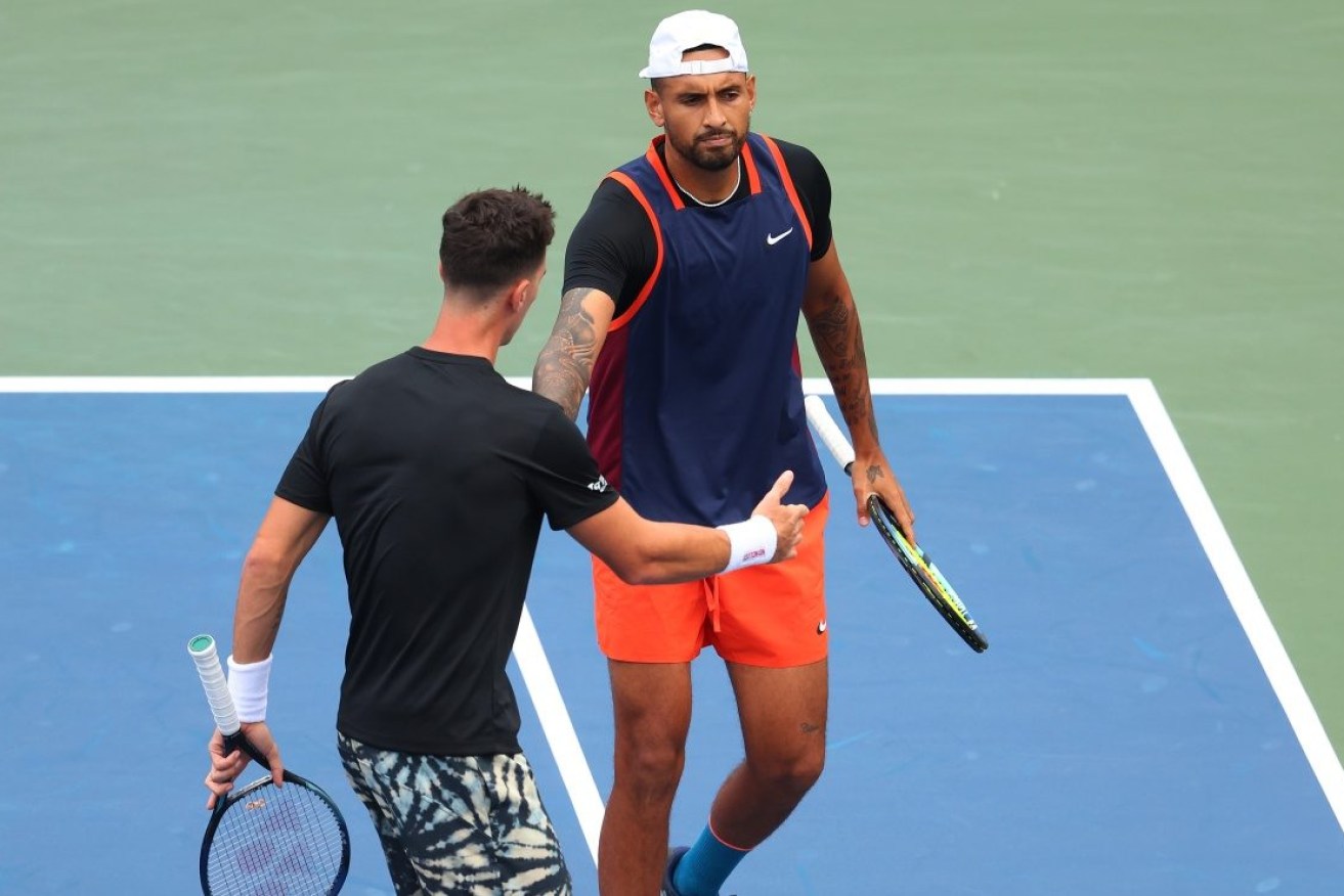 Nick Kyrgios remains only in the US Open singles draw after losing doubles with Thanasi Kokkinakis.