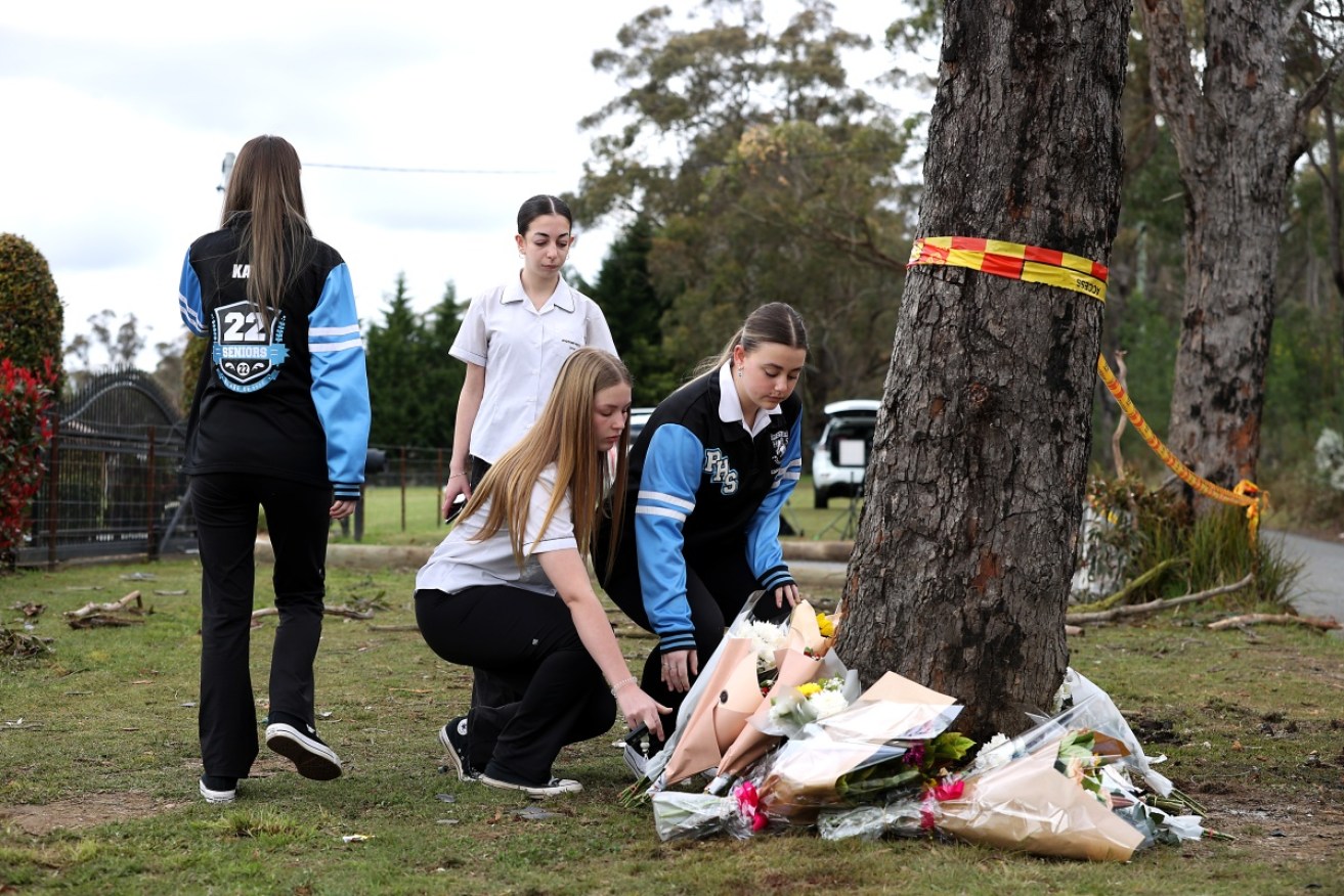 Picton High School students leave flowers at the scene of the crash that claimed the lives of five of their classmates.