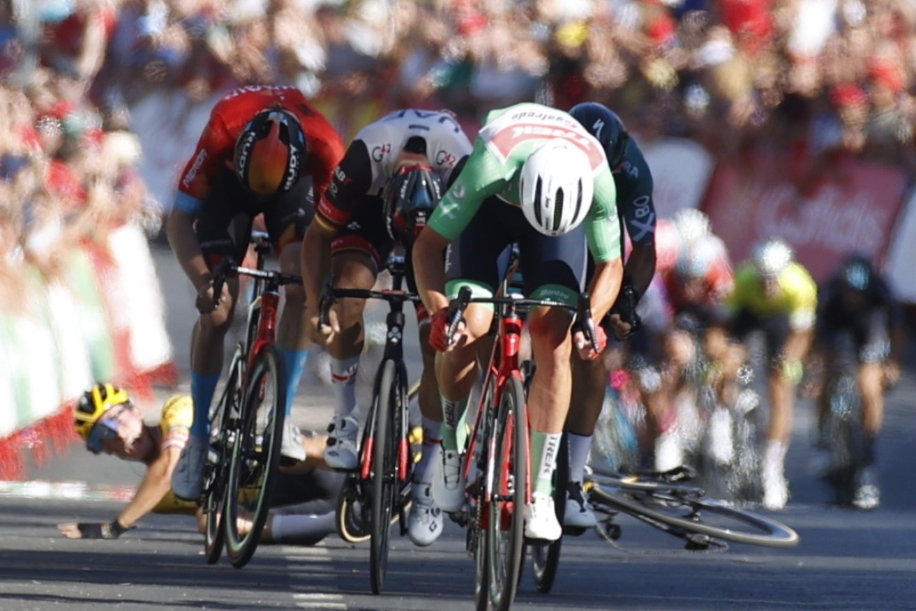 Grounded Slovenian Primoz Roglic (rear) has ended his bid for an unprecedented fourth La Vuelta title.