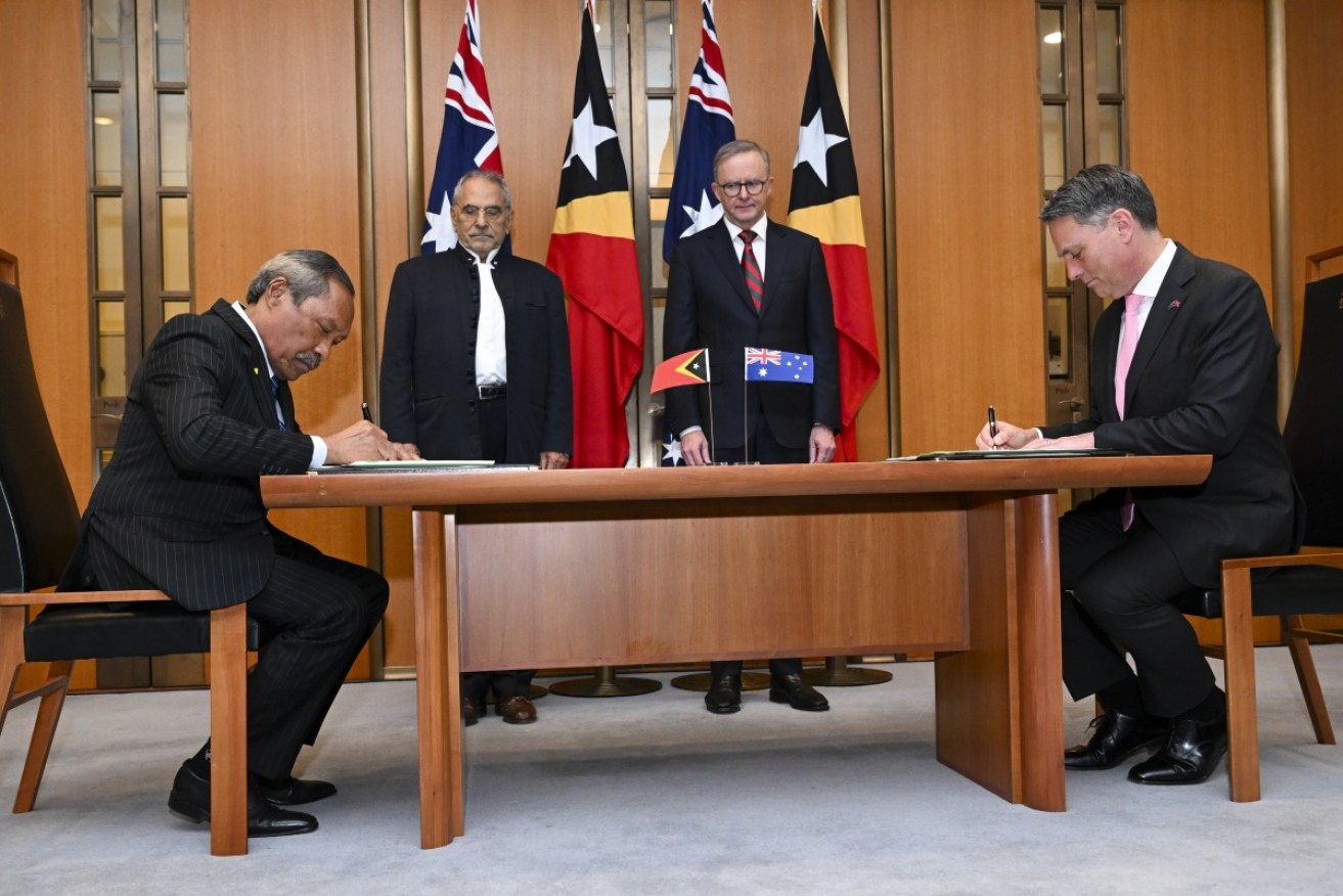 Australia and East Timor have signed a defence cooperation agreement during president Jose Ramos-Horta's visit to Canberra.
