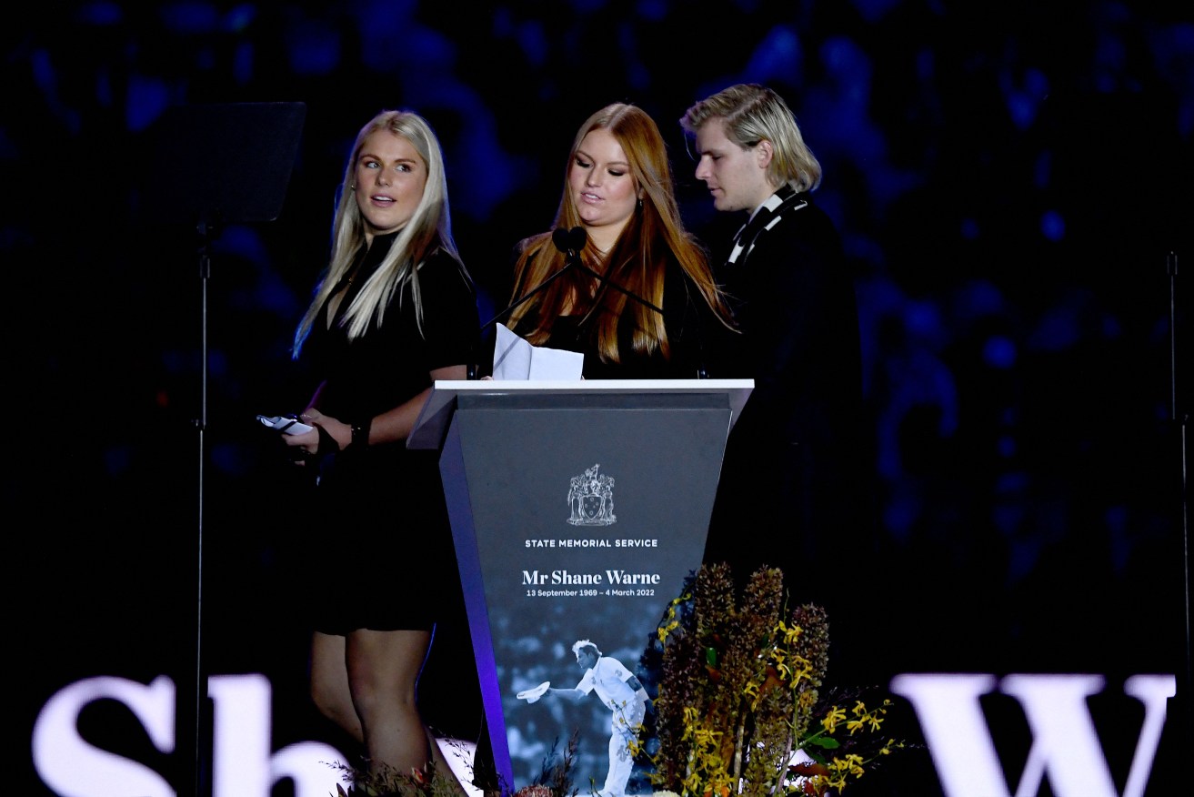 Brooke Warne (left_ with siblings Summer and Jackson at Warne's MCG memorial service.