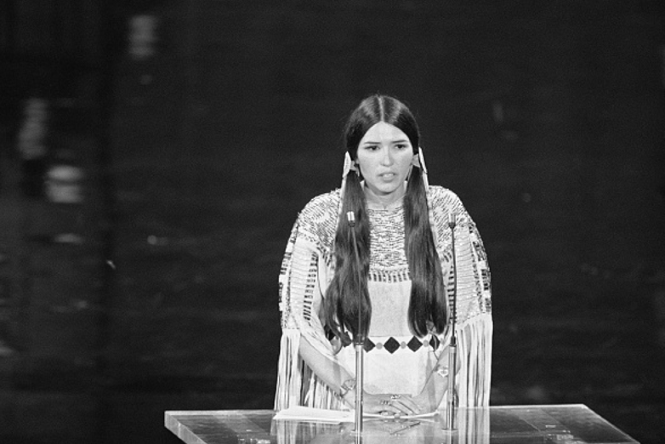 Sacheen Littlefeather endures the booing and racist gestures at the 1973 Oscars. <i>Photo: Getty</i>