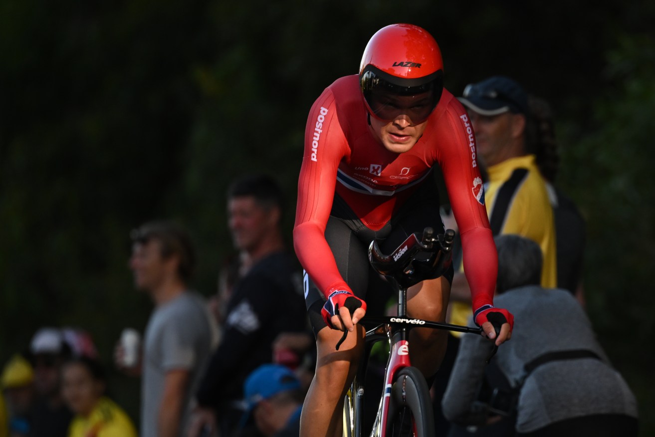 Tobias Foss was stunned to win the men's elite time-trial at the world road cycling championships. 