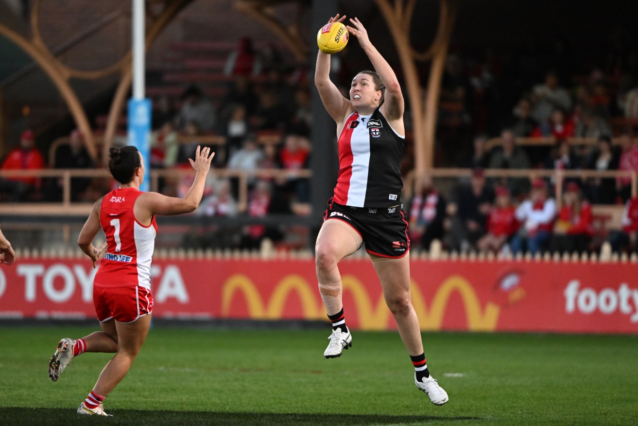 St Kilda's Erin McKinnon was hurt in a heavy tackle in her team's AFLW loss to Geelong.