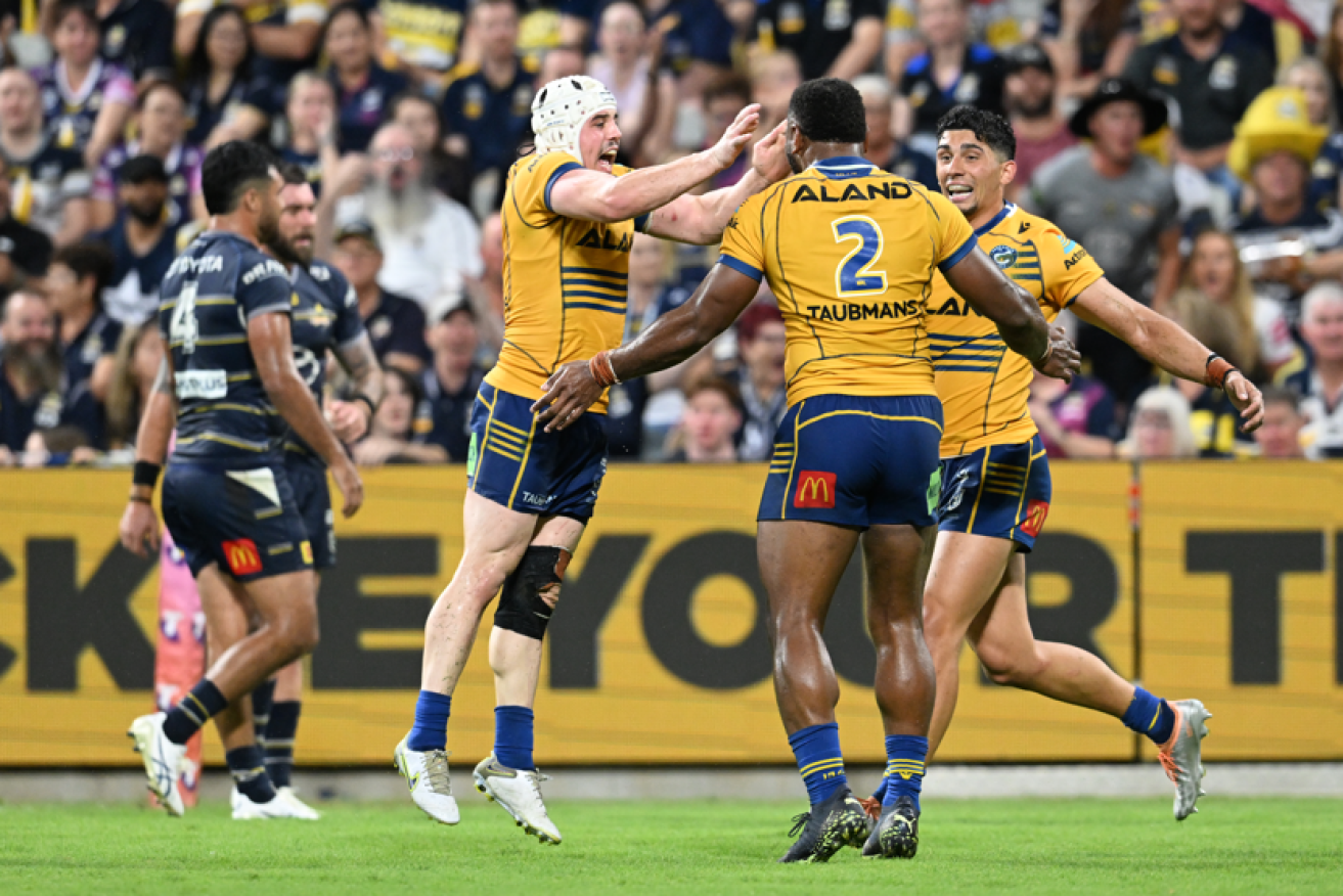 Maika Sivo (centre) of the Eels celebrates scoring a try with team mates during the NRL preliminary final against the Cowboys. <I>Photo: AAP</i>