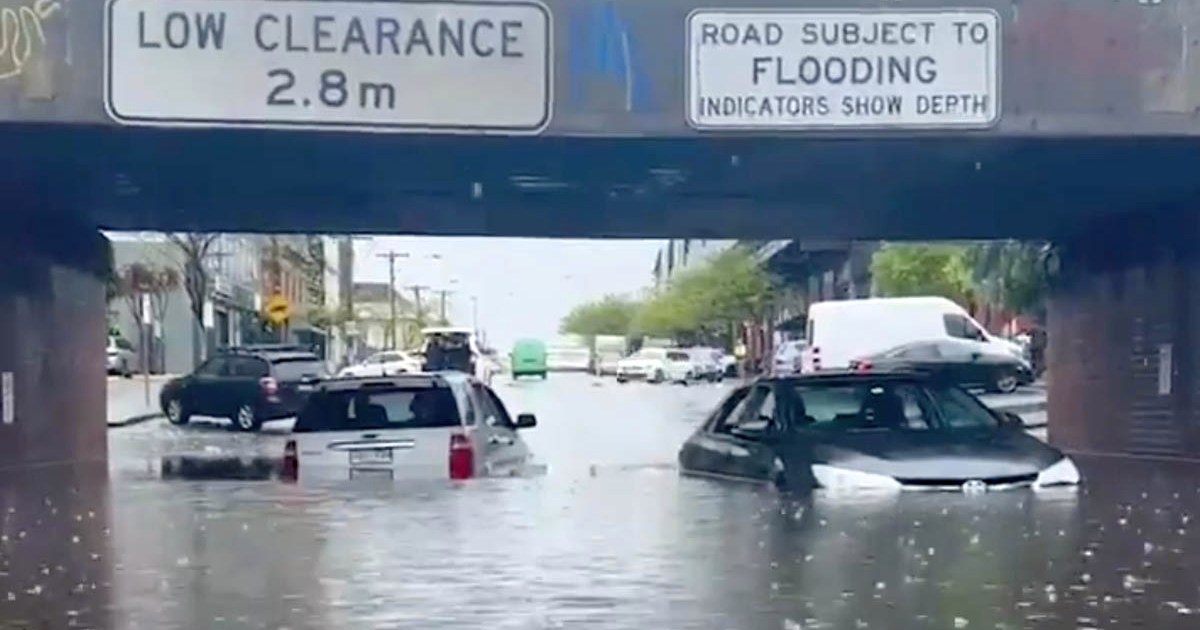 Flood rescues, warnings as storms drench two states